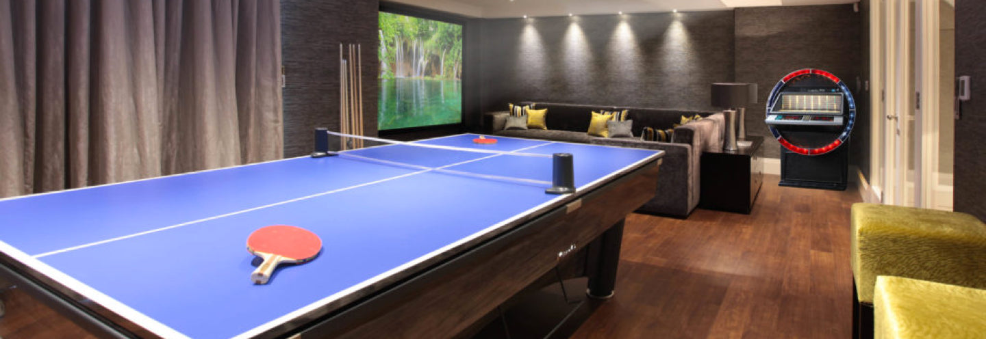 A luxury games room in Hertfordshire showcasing a bespoke copper pool ...