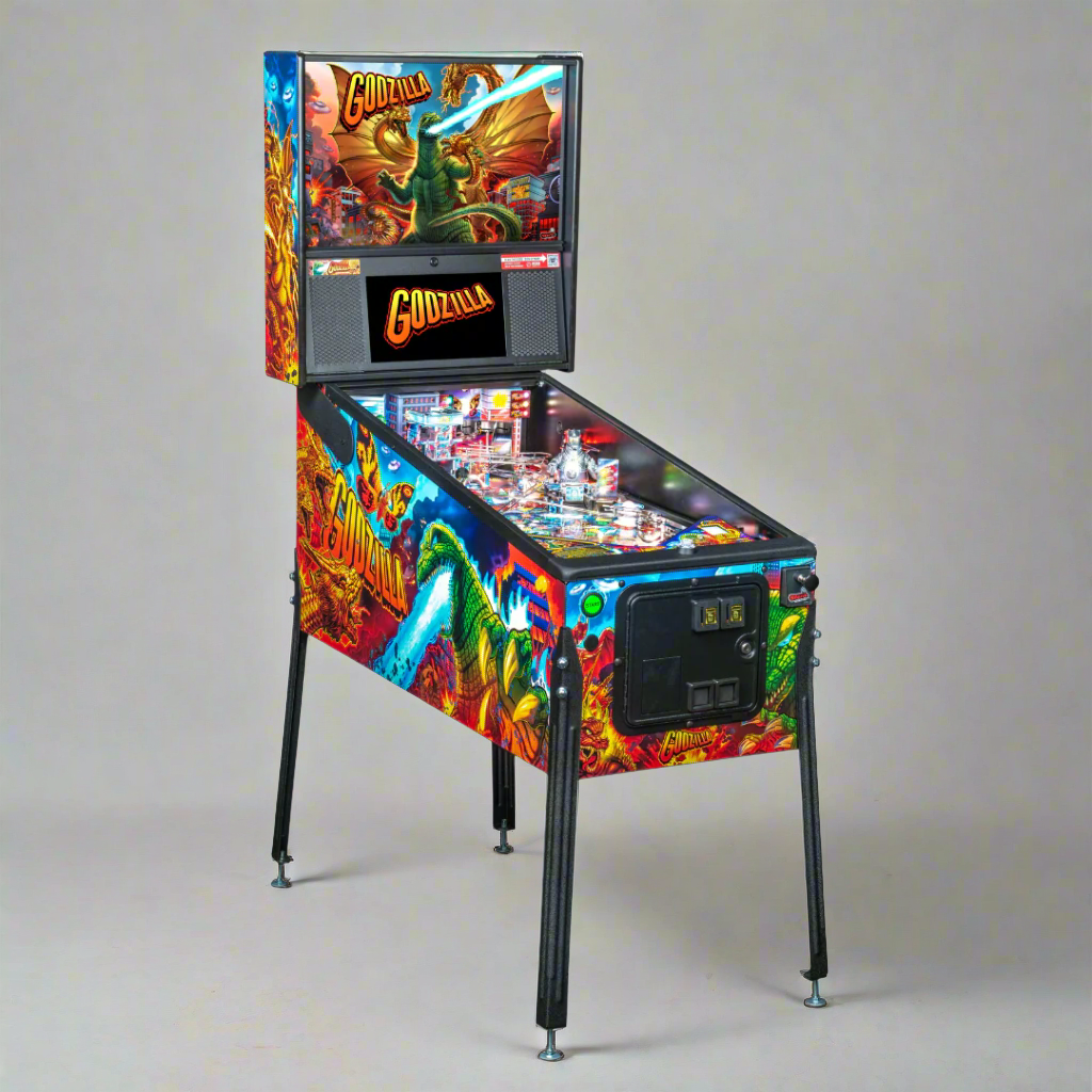 A colorful pinball machine featuring artwork with the character Godzilla and other monster characters from the movie.