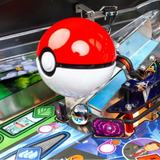 Close-up of a pinball machine with a Poké Ball design, featuring the Pokémon logo.