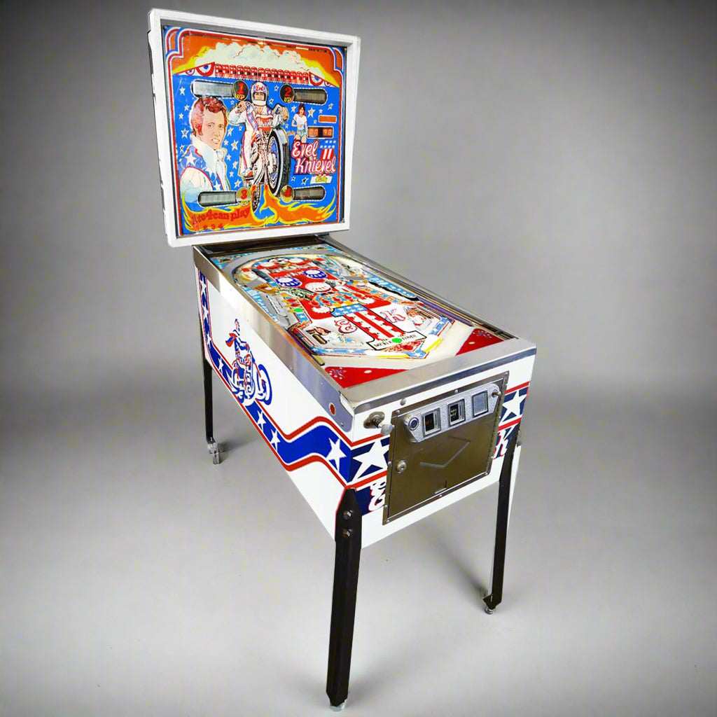 A restored 1977 Evel Knievel pinball machine featuring colorful artwork on the body and backglass.