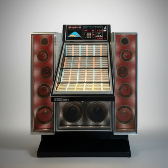 A restored late 80's NSM 240i vinyl jukebox with red and silver speakers, displaying a selection of vinyl records.