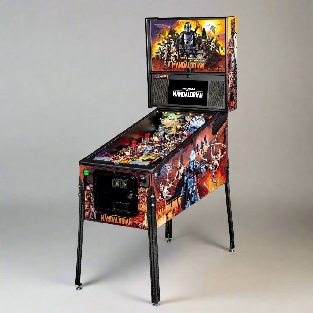 A pinball machine with artwork based on the Mandalorian series, featuring characters and iconic imagery from the show.